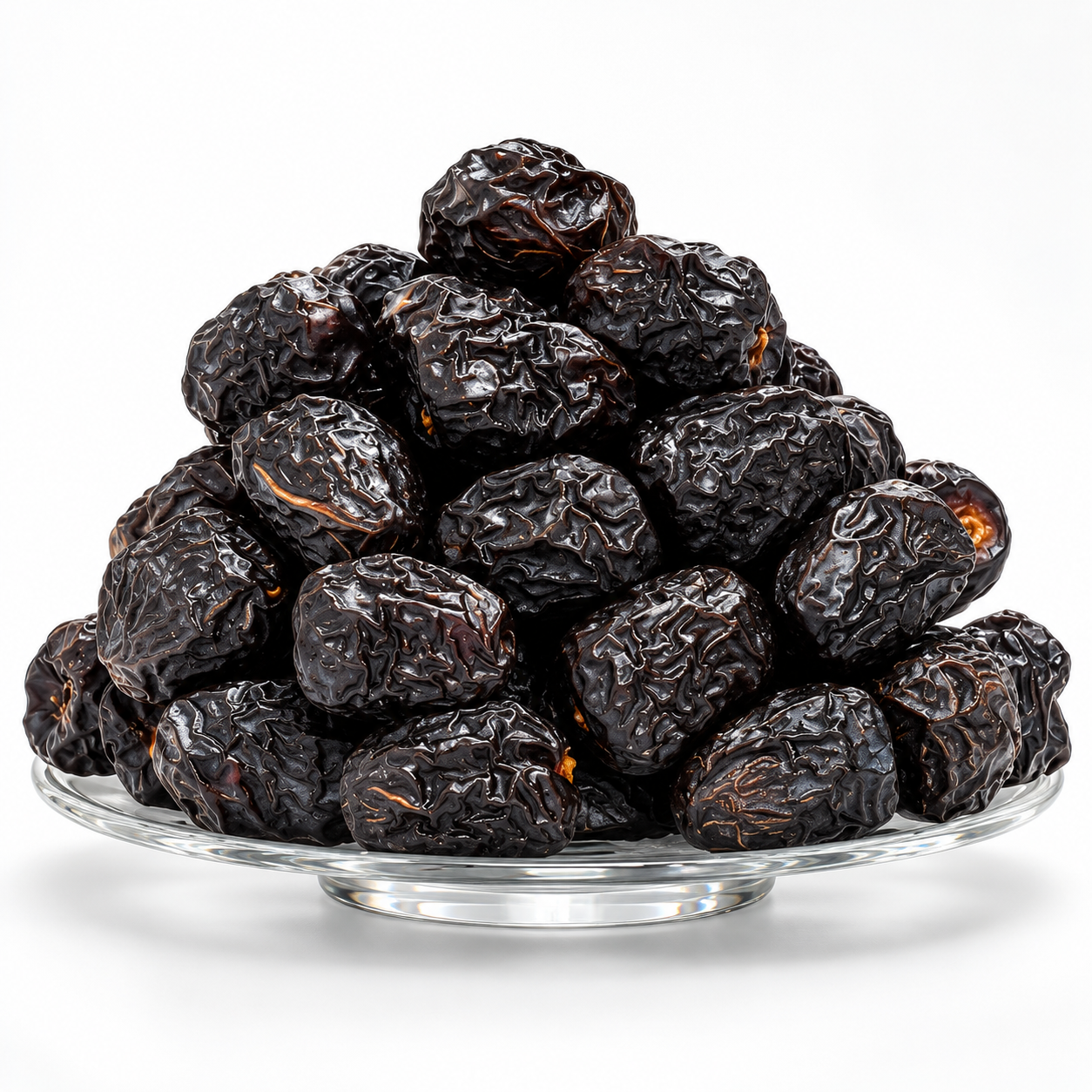 Ajwa dates from Madinah on a glass plate